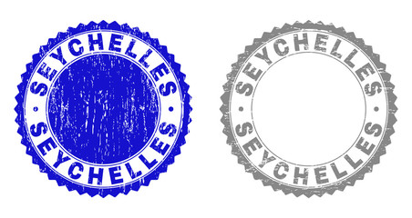 Grunge SEYCHELLES stamp seals isolated on a white background. Rosette seals with distress texture in blue and gray colors. Vector rubber stamp imprint of SEYCHELLES tag inside round rosette.