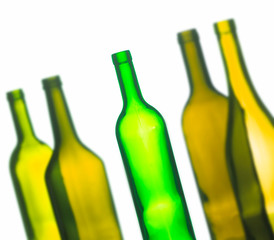 ABSTRACT IMAGE OF GROUP OF FIVE GREEN WINE BOTTLES ON WHITE BACKGROUND