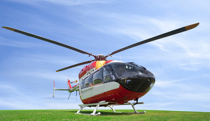 helicopter standing on green grass field, isolated on white background © night_cat