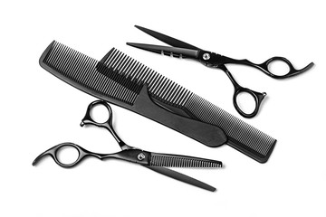 black scissors iand comb