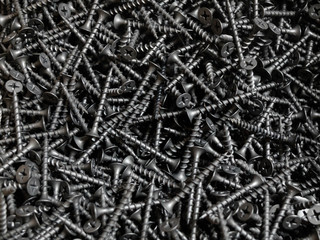 Black screws for wood made of steel with cross-shaped grooves on conical head 
