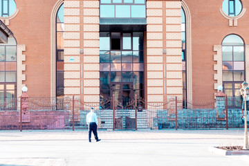 man guard patrolling the area in the open. 