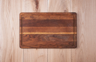  empty old kitchen cutting board on a wooden table