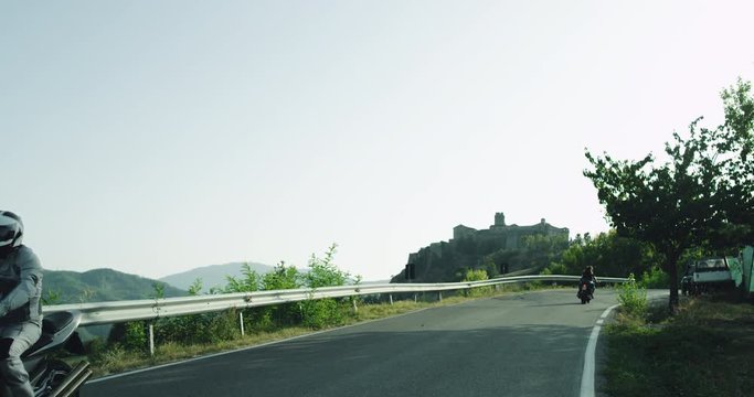 Three motorcycle in the middle of motorway have a nice ride , in amazing landscape view