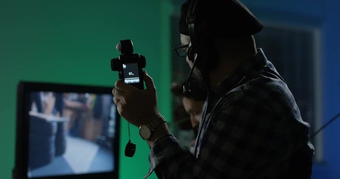 Young director giving instructions on a film set