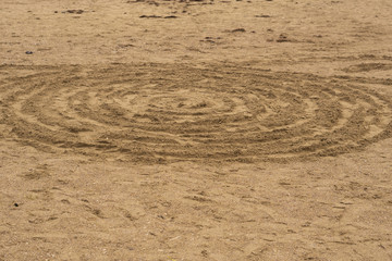 Circle Patterns in Sand.Circles on the sand. Cockles circles. Sand.