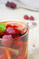 Close-up of a cup of  berry tea and berry fruits