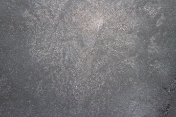 Frozen window photographed in the evening with a flicker of color