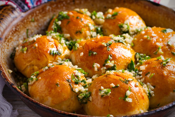 Garlic bread, buns. Bread rolls with garlic and parsley. horizontal