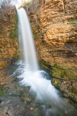 Fototapeta na wymiar Waterfall in Muel village in Zaragoza province, Spain