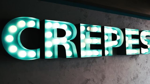 crepes sign, crepe shop on street, in Paris France Europe. Cuisine is a major industry in the city of Paris.