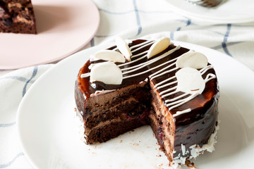 Homemade chocolate cherry cake, side view. Close-up.