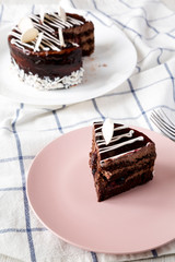 Piece of homemade chocolate cherry cake, low angle view. Closeup.