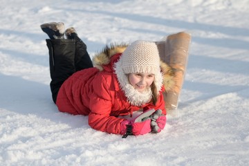 Child having fun on snow tube. 