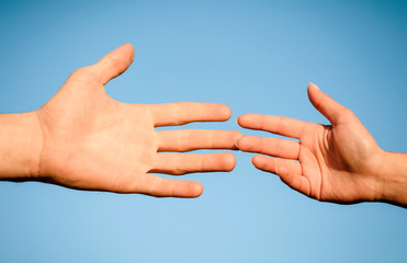 couple hands. Sky