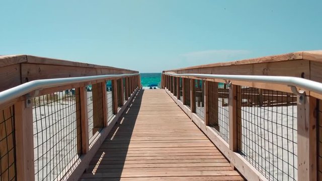 Walking to beach on wooden walkway