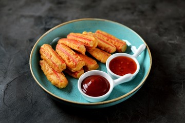 Crab sticks fried with sauces.  © chudo2307