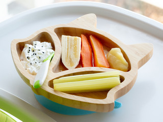 Baby eating by hands, Baby eating organic bio vegetables with BLW method, baby led weaning. Happy vegetarian kid eating lunch. Toddler eat himself, self-feeding. infant baby eating.