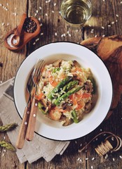 Italian risotto with shrimps, mushrooms, asparagus and parmesan. Healthy food.