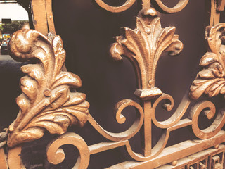 Ornament, detail of an iron gate. Decor and ornament of iron-forged city streets. Old Tbilisi architecture
