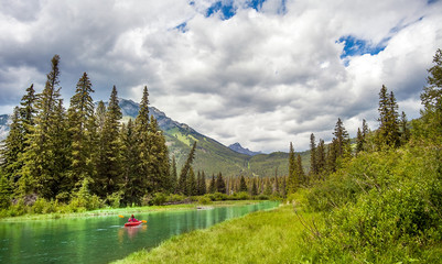Banff National Park, Alberta, Canada 06.28.2018 Canoe on the Bow River