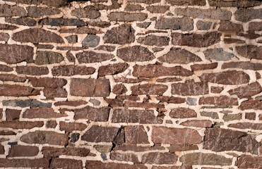 Old masonry wall using irregular stones