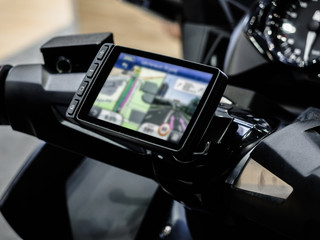 Motorcycle travel navigation on the handlebars of the bike, Finding a location on maps using the...