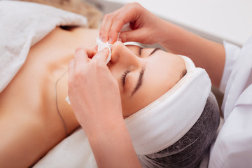 Pleasant good looking woman lying with closed eyes