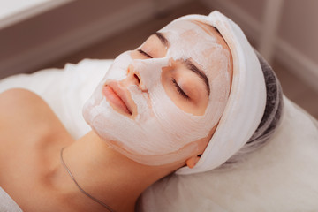 Top view of a female face with clay mask