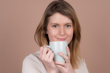 girl with a cup of tea and coffee