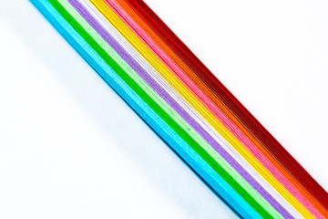 Colored paper on a white background, rainbow colors.