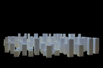White cubes are built as buildings of a business city, isolated black background, concept of a business city.