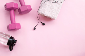 Female sport equipment on a pink background 