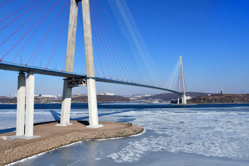 Beautiful cable-stayed bridge to Russkiy island in sunny winter weather. Vladivostok, Primorsky...