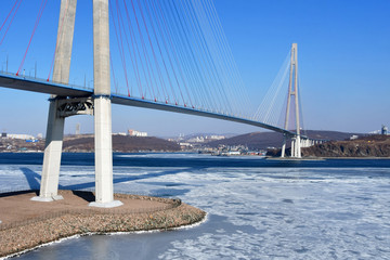 Beautiful cable-stayed bridge to Russkiy island in sunny winter weather. Vladivostok, Primorsky Krai, Russia