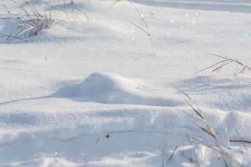 Fototapeta na wymiar footprints on white snow winter