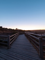 Obraz premium Empty wooded walkway at Great Ocean Road, VIC, Australia at dawn time.