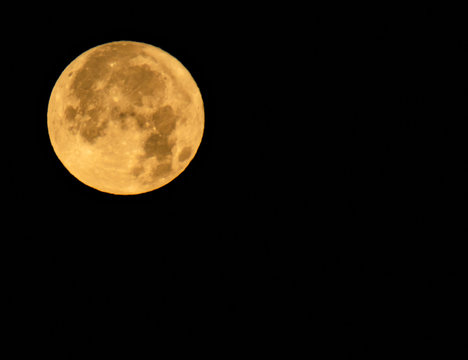 yellow moon on black sky
