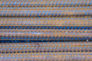 Rusty deformed bars for reinforcement concrete background. Rusty Re-bar steel or deformed bar material for building construction.