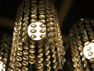 Elements crystal under the light of chandelier, Luxury and urban design round glowing light background. 