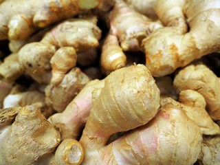 Fresh organic ginger at fresh market, Close-up heap of ginger root background