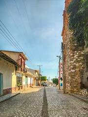 Fototapeta na wymiar Downtown district, main street entering Ixcateopan. Main streets in Guerrero. Travel in Mexico.