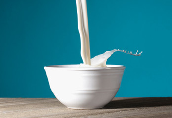 Bowl of MIlk Being Poured and Splashing Out