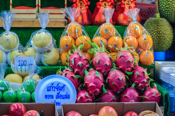 Bangkok, Thailand - April 23, 2017: Organic fruits such as mangosteen, apple, durian and dragon fruit on sale at Or Tor Kor Market, one of the world’s fresh market in Bangkok, Thailand. © kampwit