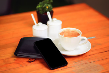 cup of coffee on the wooden
