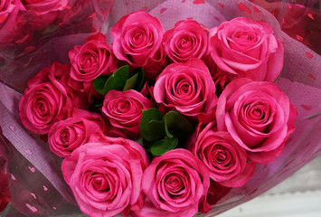  close up on packed red rose bouquet for holiday