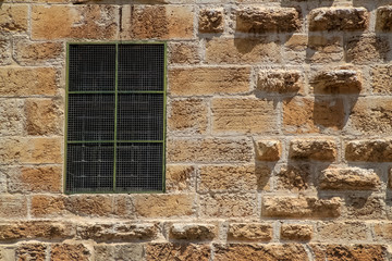 Close-up of window on ancient brick facade of southernmost wall of the ancient Temple Mount, old city Jerusalem
