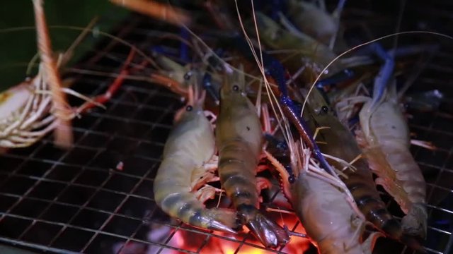 Grilled shrimp or burn shrimp on flames in background,Fresh river shrimp grilled,Fresh river shrimp grilled. 