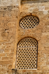 Fototapeta na wymiar Windows on wall of ruins of Muslim palace built with Temple Mount walls in Jerusalem