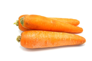 Fresh carrots on a white background